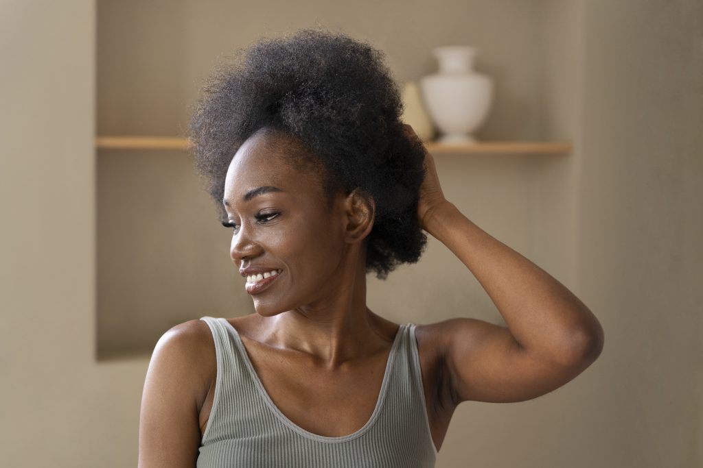 smiley woman with afro hair medium shot
